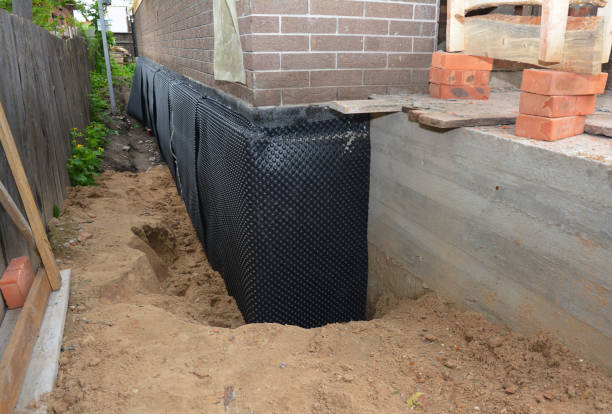 SJ Waterproofing Pros technician performing targeted Basement Waterproofing assessment in Milan, IL